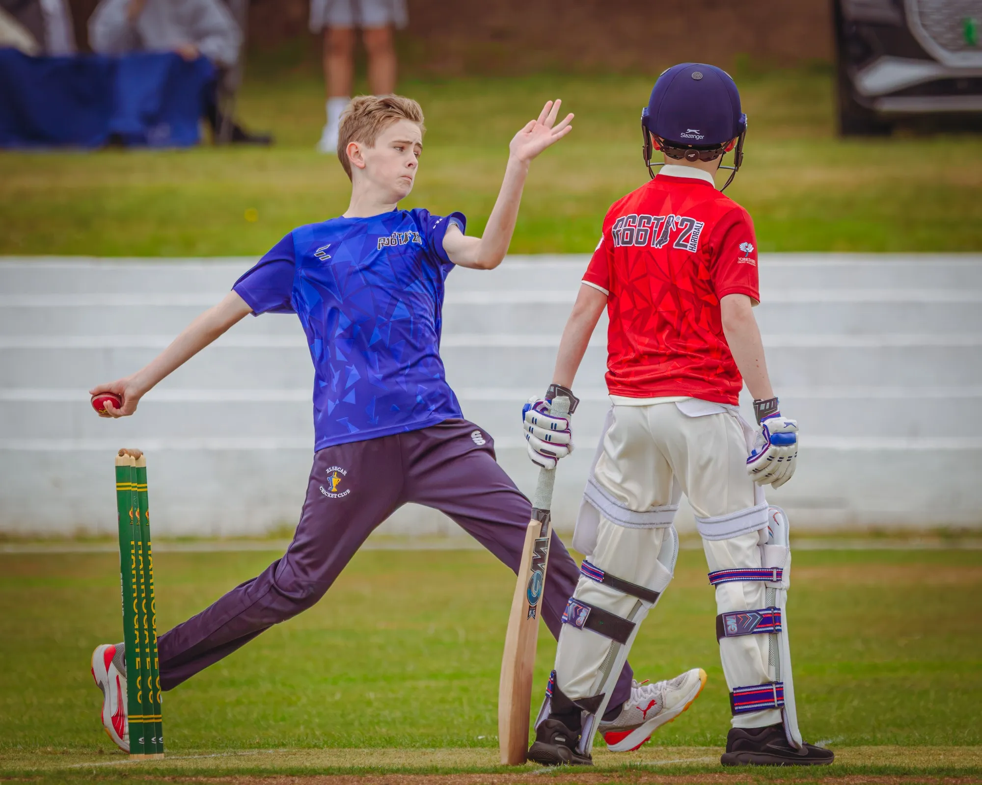 A young bowler in his delivery stride at an R66T Academy match