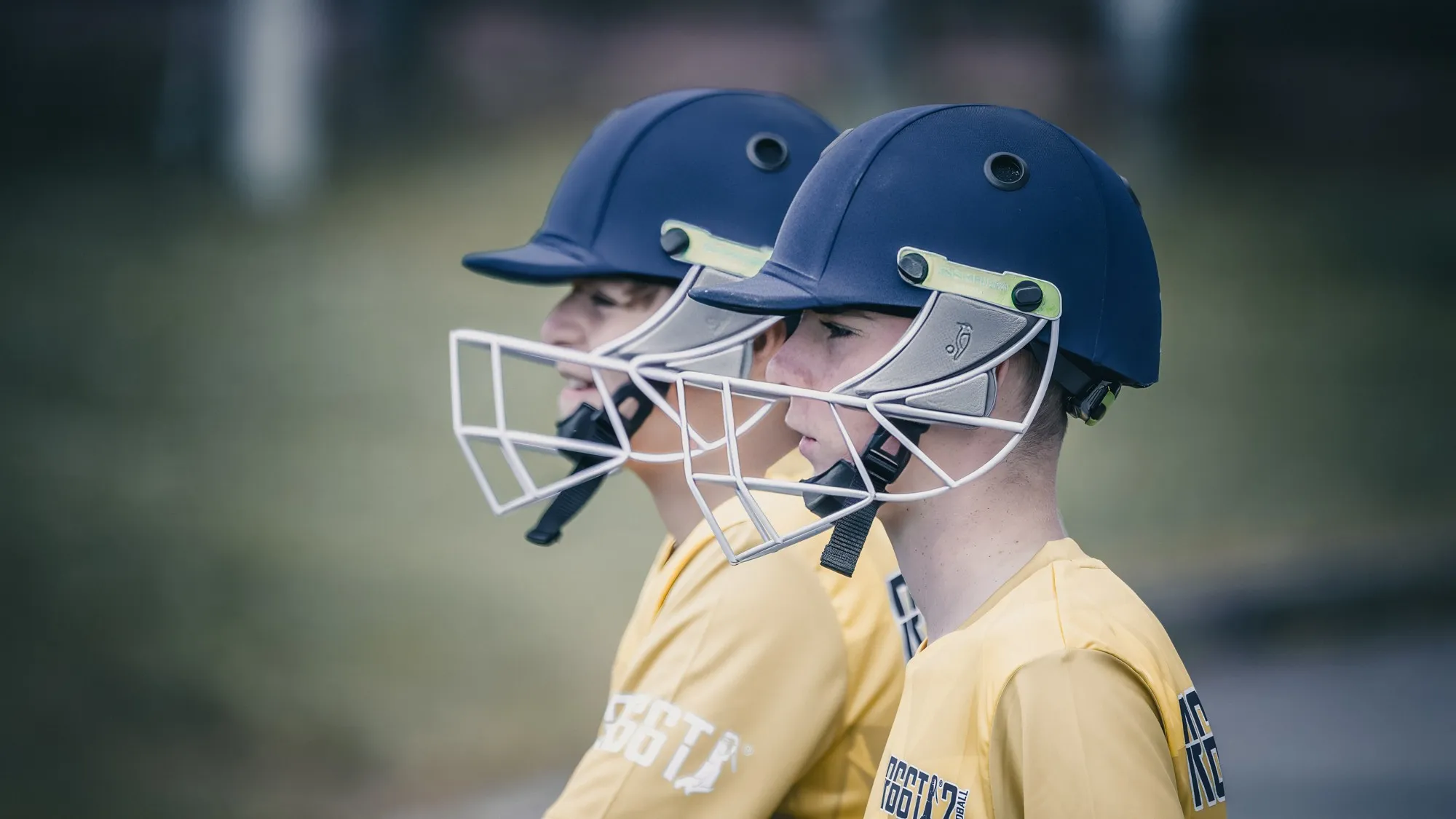 Two R66T Academy batters in helmets, waiting to bat